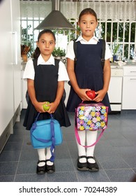 Two Little Sisters Going To School.