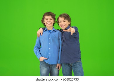 The two little twin gesture on the green background - Powered by Shutterstock