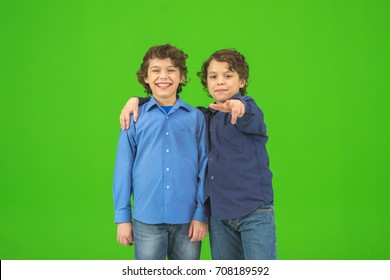 The two little twin gesture on the green background - Powered by Shutterstock