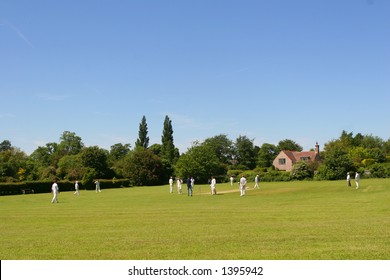 Two Local Cricket Teams On A Village Green