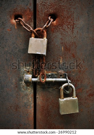 two lock on rusty iron door