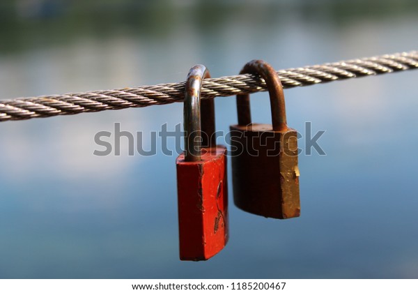 two locks love\
forever bridge water\
background