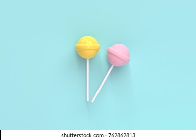 two lolipop yellow and pink on mint blue pastel background.sweet candy concept - Powered by Shutterstock