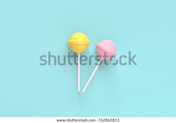 两个棒棒棒糖黄色和粉红色薄荷蓝色柔和的背景 甜蜜的糖果概念库存照片 立即编辑