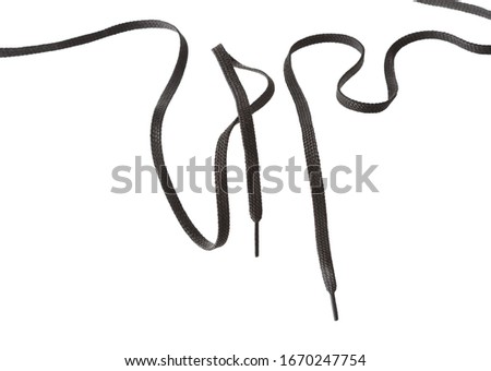 two long curved black shoe laces isolated on white 