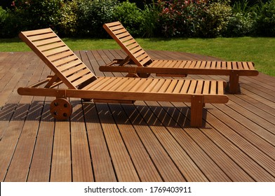 Two Lounge Chair On An Exotic Wood Terrace