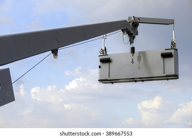 Two maintenance workers in the cabin of crane