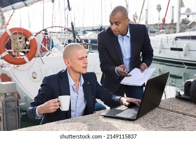 Two Male Business Partners Working At The