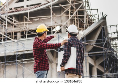 Two Male Engineer Looking Commercial Building Structure, Blur Image