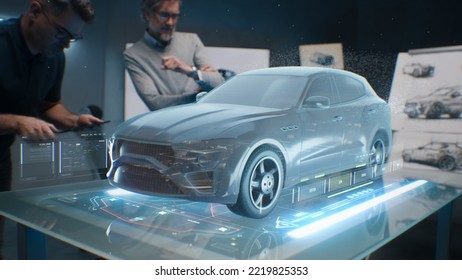 Two male engineers using digital tablet App, developing 3D model of a sustainable eco friendly electric vehicle. Designers testing car bodys air streamline properties testing aerodynamic parameters
