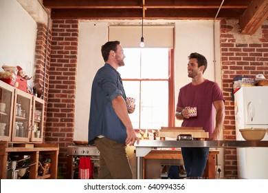 Two Male Friends Hanging Out In Kitchen, Low Angle
