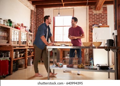 Two Male Friends Hanging Out In Kitchen, Full Length