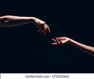 Two Male Hands Reaching Out To One Another, Almost Touching, In Front Of Dark Clear Empty Background Wall Concept. Hands Concept. Love Photo. Sensual. Hand. Help Me. Lovers. Romance. Energy. Life.
