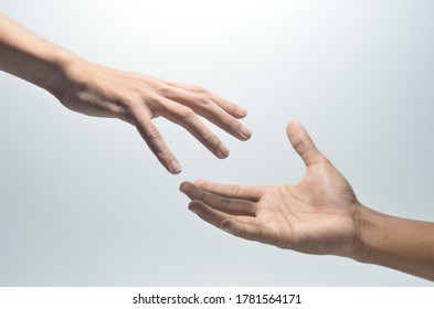 Two Male Hands Reaching Towards Each Other On Isolated White Background