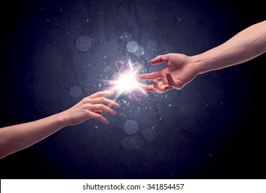 Two Male Hands Reaching Towards Each Other, Almost Touching With Fingers, Lighting Spark In Galaxy Background Concept