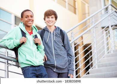 Two Male High School Students Standing Outside Building