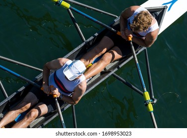 Two Male Rowers In A Double Racing Boat 