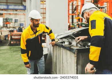 Two male workers team wearing hardhat stand sort cut metal sheets into trash bins for recycling and safety in a warehouse factory : Cost effective and reusable use of resources in the factory concept. - Powered by Shutterstock