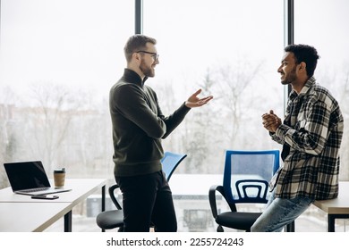 Two man colleagues working together at the office - Shutterstock ID 2255724243