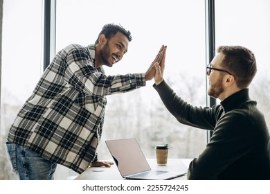 Two man colleagues working together at the office - Shutterstock ID 2255724245