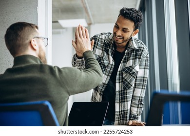 Two man colleagues working together at the office - Shutterstock ID 2255724253
