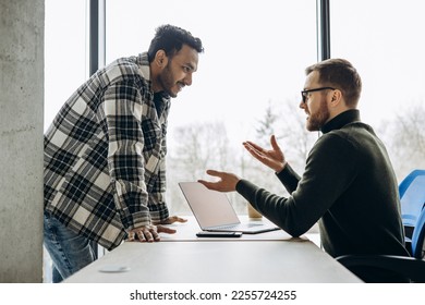 Two man colleagues working together at the office - Shutterstock ID 2255724255