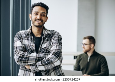 Two man colleagues working together at the office - Shutterstock ID 2255724259