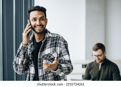 Two man colleagues working together at the office - Shutterstock ID 2255724261