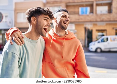 Two man couple hugging each other standing at street - Powered by Shutterstock