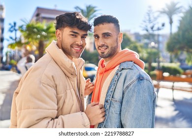 Two man couple standing together at street