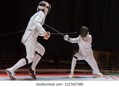 Two man fencing athletes fight on professional sports arena  - Powered by Shutterstock