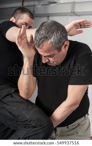 Two man fighting in underground passage. Street fights