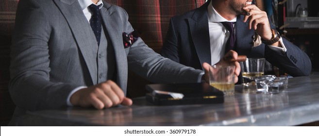 Two Man Having Drinks And Cigars