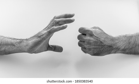 Two man are playing rock paper scissors on white background. - Shutterstock ID 1850383540