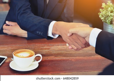 Two Man Shack Hand, Business People Meeting , Cup Of Coffee On The Table