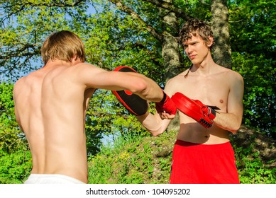 Two Man Training Muay Thai In Forest