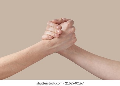Two Man And Woman Handshake Grip Hand On Beige.