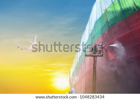 Two man worker by high pressure water jet to cleaning with Old cargo ship under repair coating painting in shipyard