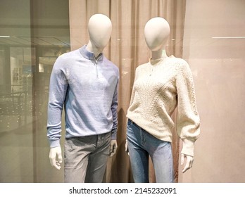 Two Mannequins In Shop Window. Female And Male Dummies. Family Shopping