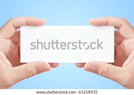 Two man's hands holding long blank paper business card on light blue background, copy space fot your message or adverisment