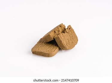 Two Marijuana Cannabis Pollen Hashish On A White Background.