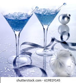two martini glasses filled with clear blue alcoholcrushed ice and swizzle stickssilver - Christmas Martini Glasses two martini glasses filled with clear blue alcoholcrushed ice and swizzle stickssilver - Christmas Martini Glasses
