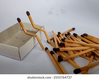 Two matches burning sitting together on the matchbox in the copy space. Two matches in flame as a metaphor of togetherness friendship, Love And Romance Concept. Matchstick art photography. - Powered by Shutterstock