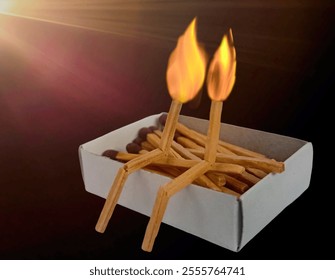 Two matches burning sitting together on the matchbox in the copy space. Two matches in flame as a metaphor of togetherness friendship, Love And Romance Concept. Matchstick art photography. - Powered by Shutterstock