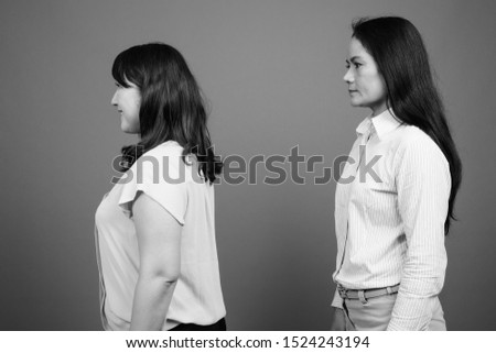 Similar – Image, Stock Photo happy twin sisters stand back to back