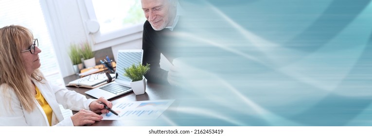 Two Mature Business People Working Together In Office; Panoramic Banner