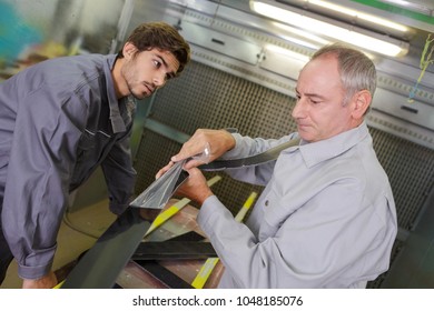 two mechanics working in the workshop