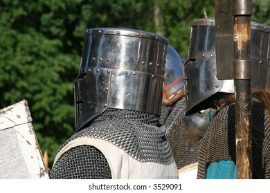 Two medieval knights in helmets