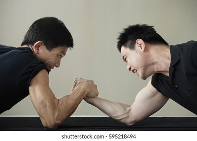 Two men arm wrestling