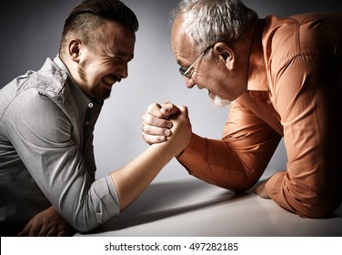 Two Men Arm Wrestling Competition.